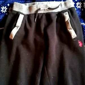 Black, gray, and red string sweat pants.